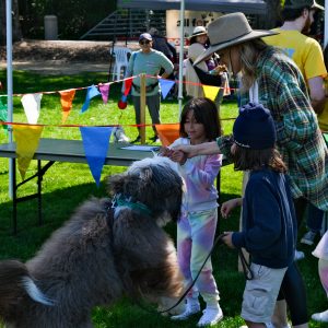 Children petting dog at Bark in the park